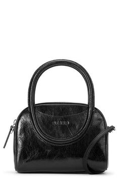 Debossed logo detailing makes a signature statement against the richly textured leather of a scaled-down bowler bag fitted with rolled top handles and an optional crossbody strap. Top zip closure Top carry handles; crossbody strap Exterior slip pocket Interior wall pocket Structured silhouette with flat base for stability Lined Leather Imported Staud Top Handle Evening Bag, Staud Evening Bag With Top Handle, Staud Evening Shoulder Bag With Top Carry Handle, Staud Top Handle Bag With Detachable Strap, Staud Evening Bags With Top Carry Handle, Staud Evening Bags With Detachable Handle, Staud Bags With Top Carry Handle For Everyday, Staud Double Handle Evening Bag, Staud Top Handle Shoulder Bag