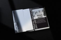 an open brochure with black and white text