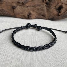 This black braided bracelet or anklet is handmade with 1.5mm waterproof polyester cord. It is unisex in style and about 6mm wide. Clasp-free and easy to wear, this item fits over the hand/foot. Bracelets open an additional 4 inches to fit over the hand. Anklets open an additional 5 inches to fit over the foot. Ends are pulled to adjust size. It arrives gift wrapped as pictured.  Please see my store for a full jewelry line! I am happy to answer any questions :) This item is not made for children Braided Leather Bracelet, Braided Bracelet, Cord Bracelet, Miyuki Beads, Black Braids, Cord Bracelets, Braided Bracelets, Beautiful Bracelet, Friendship Bracelets