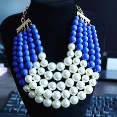 This Chunky Imitation Pearl Statement Necklace features a captivating combination of lustrous blue beads and delicate white imitation pearls, meticulously arranged to create a stunning contrast and visual appeal. The chunky design adds a touch of drama and boldness to any outfit, making it the perfect accessory to elevate your look for any occasion. Type: Chokers Necklaces Style: TRENDY Pearl Type: Simulated-pearl Shape\pattern: Geometric *Note Delivery Time: Due to the current global crisis (CO Necklaces Style, White Choker, Pearl Statement Necklace, Outfit Making, Pearl Types, Pearl Choker, Chunky Necklace, Shape Pattern, Blue Beads