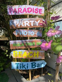 a wooden sign that says paradise party photo beach tiki bar