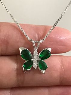 Sterling Silver Emerald CZ Butterfly Necklace Emerald is the birthstone for May. This makes a perfect gift for those loved ones born in May. Metal: All components are made from solid .925 Sterling Silver Stone: Cubic Zirconia Measurement: pendant height is 18mm including bail and 17mm at widest part Choose Chain Length At Checkout You can find other CZ and Birthstone Jewelry in my shop here https://www.etsy.com/shop/LinksAndStones?ref=seller-platform-mcnav&section_id=24399452 Please feel fre Silver Green Jewelry, Green Butterfly Necklace, Green And Silver Jewellery, Quinceanera Necklace, Emerald Butterfly, Butterfly Necklace Silver, Quinceanera Jewelry, Born In May, Color Verde Claro