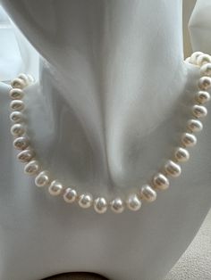 Adorn yourself with the timeless elegance of our Freshwater Egg Shape Pearl Necklace. Featuring lustrous freshwater pearls in a graceful egg shape, this necklace is a testament to refined beauty and sophisticated style. Features: Material: Genuine freshwater egg shape pearls and high-quality, hypoallergenic stringing material. Pearl Size: Each egg-shaped pearl measures approximately 7-9mm, offering a smooth, symmetrical design. Necklace Length: 17 inches. Clasp: Secure and elegant platinum-plated lobster claw clasp for ease of wear and removal. Design: Classic and versatile, perfect for both casual and formal occasions. Benefits: Elegant Design: The smooth, egg-shaped pearls exude a sophisticated charm, adding a touch of luxury to any outfit. Versatile Wear: Suitable for weddings, parties, Classic Teardrop Baroque Pearl Necklace, Classic Pearl Drop Pear-shaped Necklace, Classic Oval Single Strand Necklace, Oval Pearl Bead Wedding Jewelry, Elegant Pearl White Teardrop Pearl Necklace, Classic Baroque Pearl Necklace In Pearl White, Classic Pear-shaped Pearl Necklace For Formal Occasions, Pearl White Oval Necklace With Pearl Pendant, Pearl White Oval Necklace With Pearl Chain