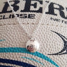 a close up of a ball on a chain with the number twenty six in it