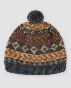 a knitted hat with a pom - pom on the front and side