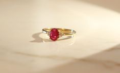 Stunning, timeless and classy eternity Unique ring. Decorate yourself in luxury with this The Loupe Club ring. The 10K Yellow Gold jewelry boasts Oval-Cut Prong Setting Genuine Ruby (1pcs) 0.50 Carat and Round-Cut Prong Setting Diamond (6 pcs) 0.07 Carat accent stones for a lovely design. This ring is weight 1.43 grams. Crafted with 10k Yellow Gold, this delicate Ring is polished to a high finish shine. Elegant Round Ruby Promise Ring, Elegant Oval Ruby Ring With Vvs Clarity, Timeless Ruby Ring With Accent Stones For Anniversary, Timeless 14k Gold Ruby Promise Ring, Elegant Ruby Cluster Ring, Elegant Ruby Rings With Brilliant Cut, 14k Gold Timeless Ruby Promise Ring, Elegant Ruby Diamond Ring With Vvs Clarity, Elegant Ruby Ring With Center Stone For Promise