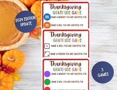 three thanksgiving gift tags with pumpkins and fall leaves on the table next to them