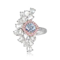 This ring features a 1.18 carat GIA-certified cushion cut Fancy Very Light Blue diamond, set in prongs and surrounded by a halo of round fancy pink diamonds. The fancy pink diamonds weigh 0.16 carats in total. An asymmetrical design of pear shape rose cut diamonds is set accenting the center stone, with a total diamond weight of 0.35 carats. Diamond-studded shoulders featuring multiple rows of micro-pave round brilliants lead past a geometric under-gallery decorated with additional round brilliant diamonds. The total weight of the round brilliant cuts is 0.55 carats. This ring is 18k rose gold on 18k white gold.

A copy of the GIA certificate for the center stone is available upon request.

The measurements of this ring are approximately 2.7cm x 1.6cm.

This ring can be resized to any fing Light Blue Diamond, Fancy Color Diamond Ring, Estate Diamond Jewelry, Glamorous Jewelry, Gia Certificate, Colored Diamond Rings, Pink Diamonds, Fancy Diamonds, Fancy Color Diamonds