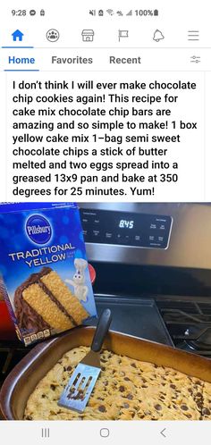 a pan filled with chocolate chip cake next to a box of crackers and a spatula