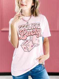 Holiday graphic tee. Fabric content: Graphic tee - 100% Cotton Holiday Graphic Tees, Emma Lou, Feeling Lucky, Black Tee, Graphic Tee, Graphic Tees, Boutique, Feelings, Pink