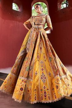 Mustard yellow jamawar attached cancan panelled lehenga in floral geometric pattern with resham, zari and pearl hand embroidery. Paired with a matching padded blouse embellished with resham, pearl and zari embroidery, dupatta in shimmer tissue base with zari border and embellished belt. - Aza Fashions Fitted Yellow Traditional Wear With Traditional Drape, Yellow Fitted Traditional Wear With Traditional Drape, Yellow Fitted Traditional Wear With Drape, Traditional Yellow Wedding Dress, Yellow Raw Silk Choli With Intricate Embroidery, Yellow Raw Silk Dress With Intricate Embroidery, Yellow Traditional Wear With Intricate Embroidery For Reception, Traditional Yellow Wear With Intricate Embroidery For Reception, Fitted Yellow Traditional Wear