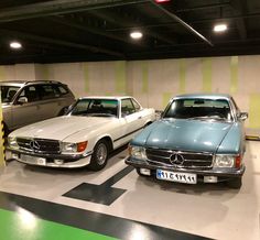 three mercedess are parked in a parking garage