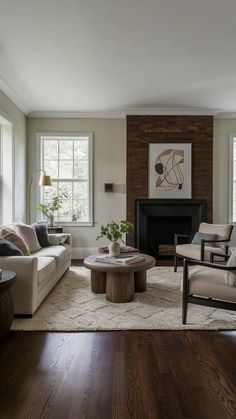 a living room with two couches and a coffee table in it's center