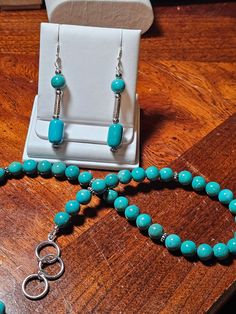 A beautiful natural Hubei turquoise necklace is the perfect go to when you want to wear something that is casual, yet very classic and total quality. This piece would look great with jeans or a little black dress.  Felling like dressing it up? Great for layering. Dimensions: 16.5 - 18 inches adjustable Turquoise beads: 8 mm rounds Cones with of without marching Hubei and sterling silver Earrings. Length: 46.4 mm for beaded part 62.5 mm including earwire. 50mm = 2 inches Has a wonderful sterling silver triple toggle closure that matches the piece beautifully and really sets off the piece. All silver is solid sterling silver Stones are all natural and untreated. Great quality one of a kind necklace that was completely hand made by me. Handmade Turquoise Multi-strand Jewelry, Adjustable Turquoise Earrings With Faceted Beads, Rustic Turquoise Nickel-free Earrings, Hubei Turquoise, Whimsical Turquoise Nickel-free Earrings, Gig Harbor Wa, Artisan Turquoise Nickel-free Earrings, Gig Harbor, Natural High