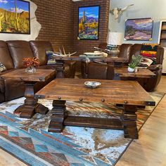 a living room filled with lots of furniture and decor on top of a wooden floor