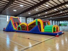 an inflatable bounce house is set up on the floor for kids to play