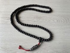 Handmade Nepali Dark brown Bodhi seed mala with Natural DZI Stone Beads From Nepal. 11mm with 108 beads Necklace Traditional Handmade Mala For Meditation, Handmade Amulet Mala For Meditation, Adjustable 108 Beads Mala Amulet, Handmade Mala Amulet For Rituals, Handmade Amulet Mala For Rituals, Traditional Hand Knotted Mala For Meditation, Traditional Brown Mala For Meditation, Beaded Mala Amulet For Meditation, Beaded Amulet Mala For Meditation