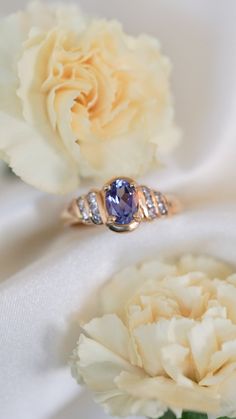 * Ring Material: Tanzanite, Diamond, 14K Yellow Gold * Ring Dimensions: 9x15MM Top Design, 2.9MM Tapering Band * Size: 6.5 * Stone Weight & sizes: Tanzanite - 0.86ct, Diamond - 0.25ct * Overall weight: 4.2g Timeless Tanzanite Rings For Anniversary, Classic Rings With Gemstone Accents For Anniversary, Classic Anniversary Rings With Gemstone Accents, Classic Tanzanite Gemstones For Anniversary, Elegant Oval Tanzanite Birthstone Ring, Classic Diamond Ring With Gemstone Accents For Anniversary, Anniversary Tanzanite Sapphire Ring With Gemstone Accents, Tanzanite Rings With Gemstone Accents For Anniversary, Tanzanite Gemstones For Anniversary