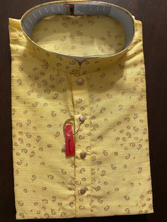 Raw Yellow Color Kurta Pajama in Self design material. Item : Men's Kurta Pajama Ready to Wear : Yes Kurta Color : Yellow Pajama Color : White Fabric : Raw Silk Pocket : Yes Disclaimer : Slight variation in actual color vs. image is possible due to the screen resolution. Traditional Pattern Sherwani For Puja, Traditional Sherwani For Puja, Transitional Sherwani With Traditional Patterns For Puja, Traditional Straight Kurta Sherwani With Bandhani Print, Traditional Bandhani Print Sherwani Straight Kurta, Traditional Sherwani With Bandhani Print And Straight Kurta, Traditional Sherwani With Bandhani Print, Diwali Bandhani Print Sherwani Straight Kurta, Sherwani With Bandhani Print For Festivals