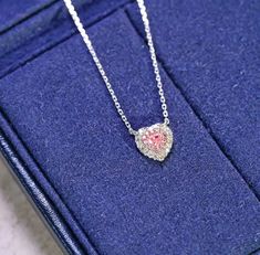 "Add a touch of elegance and glamour to your look with our stunning Pink Diamond Heart Necklace. Crafted with the finest materials, features a heart-shaped design encrusted with brilliant pink diamonds that sparkle and shine in the light. The necklace is made with high-quality materials to ensure durability and long-lasting wear. The pink diamonds are expertly cut and polished to enhance their natural beauty and brilliance. The heart-shaped design is classic and timeless, making this necklace pe Elegant White Gold Heart Necklace With Gemstone, Elegant Heart Gemstone Necklace For Wedding, Elegant Heart Necklace With Gemstone For Wedding, Luxury Pink Heart Cut Necklace, Luxury Heart Necklace For Wedding, Elegant Pink Cubic Zirconia Heart Necklace, Elegant Heart Gemstone Necklace For Valentine's Day, Luxury Diamond Cut Heart Necklace For Valentine's Day, Luxury Necklace For Wedding And Valentine's Day