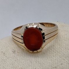 Victorian-era gold jewelry was often made in yellow gold with a soft rose gold hue. This handsome 1800s ring is crafted in 14k rosy gold that has a warm, rich appearance. The focal point is a hard-stone intaglio of a Roman soldier carved from carnelian. This ring is a generous size 12 and would make a unique wedding ring or right-hand statement ring. Please note that this ring is a true antique with over a 100-year history. You will notice in the photos there is white metal on the bottom of the 1800s Ring, Roman Soldier, Unique Wedding Ring, Wedding Rings Photos, Mens Ring Sizes, Beaded Evening Bags, Cameo Ring, Victorian Rings, Soft Rose