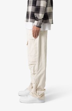 The ultrabaggy fit of these nonstretch cotton pants lets you move with ease all day long, while the cargo pockets keep all your essentials close at hand. 32 1/2" inseam; 9 1/2" leg opening Zip fly with button closure Front scoop pockets; cargo flap-patch pockets; back patch pockets 100% cotton Machine wash, tumble dry Imported Cargo Pants Outfit Men, Pants Outfit Men, Cotton Cargo Pants, Baggy Cargo Pants, Cargo Pants Outfit, Ripstop Fabric, Cotton Pants, Baggy Fits, Cargo Pants