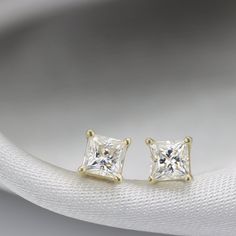 "Elegant everyday princess stud earrings set with beautifully cut White Moissanite. Full of Sparkle just like a diamond at a great price. - Moissanite info: 2 x natural Moissanites, 4 mm princess cut , 0.78 ctw Handmade by an inspired jewelry artist team with decades of experience in the craft of jewelry making. Each gemstone, each diamond is carefully picked. Using only the finest raw materials and the highest industry standard in manufacturing, design and finish. A beautiful vintage inspired p Luxury Princess Cut Earrings For Gift, Princess Cut Diamond Earrings Fine Jewelry, White Princess Cut Earrings For Anniversary, Classic White Princess Cut Earrings, Diamond White Princess Cut Earrings As Gift, Fine Jewelry Princess Cut Diamond Earrings For Wedding, Elegant Cubic Zirconia Princess Cut Diamond Earrings, Princess Cut Diamond Earrings For Gift, Diamond White Princess Cut Earrings For Wedding