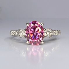 Wow picks! Pink moissanite ring 14k solid gold, Pink oval cut moissanite engagement ring for women, Unique moissanite wedding anniversary rings, #8015 at $877.00 Choose your wows. 🐕 #PersonalizedJewelry #MothersDayGift #RingForWomen #WeddingGift #EngagementRing #PinkMoissaniteRing #PinkOvalCut #UniqueMoissanite #HandmadeJewelry #14kSolidGold Pink Moissanite Ring, Grey Moissanite, Oval Cut Moissanite Engagement Ring, Moissanite Ring Set, Engagement Ring For Women, Pink Sapphire Ring, Wedding Anniversary Rings, Birthday Ring, Unusual Jewelry