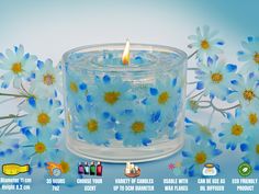 a candle with blue flowers in the background