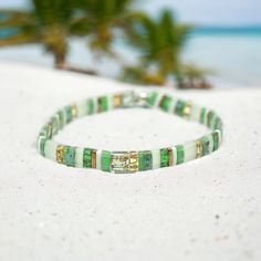 🎄 Holiday Gift Ready! 🎄 View All Bracelets HERE: https://etsy.me/4cnrWrb Explore our FIFI™ Tila Bead Bracelets--boho-chic essentials that add a pop of personality to any outfit. Handmade with love in Utah, these tile bracelets are crafted with the highest quality Japanese glass tila beads and a premium crystal elastic cord, ensuring strength, durability, and comfort. Perfect for layering, lightweight, waterproof, and ideal as a unique stocking stuffer, this boho tila bracelet suits any style, Bohemian Letter Beads Jewelry For Festivals, Summer Bohemian Beaded Bracelets With Letter Beads, Green Bohemian Friendship Bracelets For Beach, Bohemian Green Friendship Bracelets For Beach, Green Bohemian Stretch Bracelet With 8mm Beads, Bohemian Green Stretch Bracelet With 8mm Beads, Bohemian Stretch Bangle Bracelet With Letter Beads, Bohemian Stretch Bracelet With Letter Beads For Festivals, Bohemian Beaded Bracelets With Letter Beads For Festivals