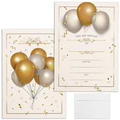 a white and gold birthday party with balloons on it's back, in front of an envelope