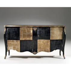 an old black and gold chest with two doors