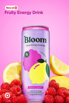 a can of bloom sparkling energy drink surrounded by raspberries and lemons