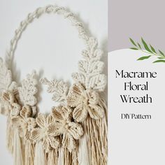 the macrame floral wreath is hanging on the wall