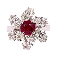 This stunning GIA certified heated ruby is the focal point in this mesmerizing custom setting in 18k white gold. The large marquis diamonds weighs 2.75 carats and surround the ruby like a pinwheel motif. The ruby is 1.14 carat and has a deep, vivid red hue. Ring Size: 6.5 & can be sized. Heart Diamond, Marquise Diamond, Ruby Ring, Diamond Heart, Cocktail Rings, Diamond Rings, Heart Ring, Floral Pattern, Ruby