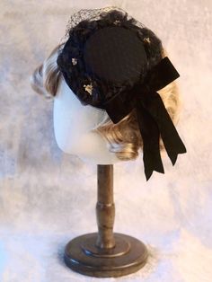 Handmade Black Bowknot Floral Design Veil Mini Hat Vintage Black Handmade Top Hat, Victorian Black Adjustable Top Hat, Victorian Adjustable Black Top Hat, Adjustable Bow Hat For Kentucky Derby, Black Adjustable Victorian Top Hat, Adjustable Hats With Bow For Kentucky Derby, Adjustable Kentucky Derby Hat With Bow, Black Hats With Round Crown, One Size Fits Most, Adjustable Evening Hat With Bow