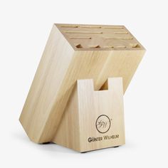 a wooden block that is shaped like an object with the word's logo on it