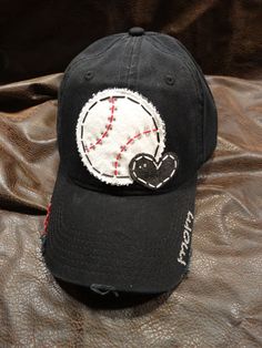 PLEASE READ MY SHIPPING DETAILS & ORDER POLICIES BEFORE YOU ORDER  This super cute Baseball LOVE Mom Bling Ball Cap includes: **Black distressed ball cap **Stitched, applique baseball with rhinestone embellishing **Fabric appliqued heart **mom on bill. If you want something else, Black Hats With Letter Print For Gifts, Cute Adjustable Black Baseball Cap, Black Hats With Letter Print As Gifts, Personalized Black Hat For Gift, Customizable Novelty Hats As Gift, Casual Black Trucker Hat For Birthday, Casual Black Hat For Birthday, Personalized Black Trucker Hat With Curved Brim, Personalized Casual Hats For Birthday