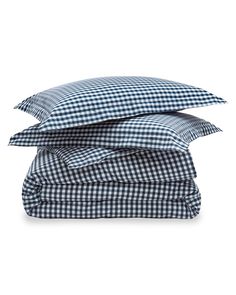 three pillows stacked on top of each other in blue and white checkered linens