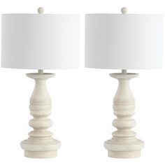 two white table lamps sitting next to each other