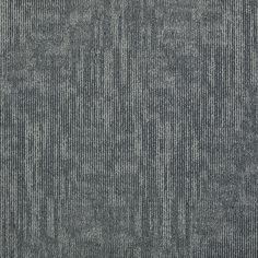 an up close view of a gray carpet with vertical lines in the middle and diagonal stripes across the top