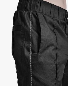 – Black in color – Tapered cut – Drawstring elastic waistband – Front raw edge seam detail – Two side construct pockets – Scar-stitched in grey color at sides – Side knee level pleated signature patch flap pocket – Side diagonal YKK Excella zip pocket – Two rear single welt pockets – Tonal stitching Biker Pants, Tracksuit Pants, Grey Color, Raw Edge, Welt Pockets, Flap Pocket, Welt Pocket, Cargo Pants, Leather Skirt