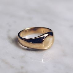 Gold toned brass Small Minimalist Ring in sizes for both men and women. This simple ring has a circular flat face but lot's of style and flat top rings are definitely in right now! Available in 925 Sterling Silver https://etsy.me/2sLAcwj Available in Larger Style https://etsy.me/2CEYcpw Ring Size Available in all sizes. Please be sure to find your exact ring size for the finger you want before ordering. See image chart above or you can use the chart on my website as a guide - https://jewelrylab. Classic Gold Midi Rings For Promise, Modern Gold Engraved Ring For Everyday, Minimalist Oval Signet Ring For Promise, Oval Gold Midi Rings For Everyday, Everyday Gold Oval Midi Rings, Everyday Oval Gold Midi Rings, Gold Brass Signet Ring For Everyday, Everyday Brass Signet Ring, Everyday Polished Signet Ring