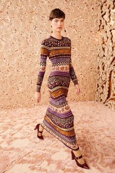 Featured in Look 40 of our Autumn/Winter 2024 runway show, the Paloma Dress is crafted from mid-weight, plush yarn jacquard, inspired by Fair Isle motifs that incorporate a considered mélange of the season's diverse patterns. This long-sleeve frock is alive with purple and golden hues and features a fitted silhouette with an ankle-grazing hemline. 2024 Runway, Paloma Dress, Nyc Boutiques, Silhouette Dress, Plush Yarn, Heart Earring, Carved Heart, Autumn Winter 2024, Calf Socks