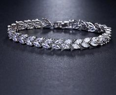 Luxury Leaf Chain Bracelet White AAA Cubic Zircon Woman's Jewelry Wedding Party Gift Fine or Fashion: FashionItem Type: BraceletsShape\pattern: PlantChain Type: Link ChainClasp Type: Toggle-claspsFunction: Mood TrackerStyle: ClassicBracelets Type: Chain & Link BraceletsMetals Type: CopperGender: WomenSetting Type: Prong SettingMaterial: Cubic Zirconia Droplet Earrings, Wedding Necklace Set, Branch Earrings, Cubic Zirconia Bracelet, Leaf Jewelry, Cz Jewelry, Bridal Bracelet, Mood Tracker, Bracelet Charm