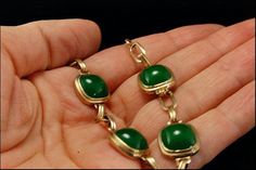 "This is a very beautiful, old and unique PEKING GLASS GILDED SILVER c. 1940 bracelet. The bracelet has a marvelous Peking glass with deep green color (11 x 11 mm) with gilded silver. It measures 7\" x 1/2\". The bracelet has a very unique and elegant feel to it and is in very good condition. 0.7 AOJFPC-806-124" Elegant Green Cabochon Bracelets, Art Deco Jade Jewelry For Formal Occasions, Formal Art Deco Jade Jewelry, Antique Green Handmade Bracelet, Vintage Jade Jewelry For Jewelry Making, Handmade Antique Green Bracelet, Victorian Green Bracelet Jewelry, Green Brass Jewelry For Formal Occasions, Green Cabochon Bracelet For Formal Occasions