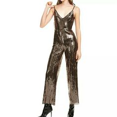 Fabulous Jumpsuit Detailed With Shimmery Stripes Of Black And Gold Sequins. It Has Adjustable Shoulder Straps, Cowl Scoop Back Display, V-Neck, Elasticized Waist, And Is Straight Leg. Size Xxs Length From The Straps : 54" Length From The V-Neck Down : 45" Waist Flat : 10" But Can Stretch Up To 12" Shell: 97% Polyester, 3% Spandex Lining: 100% Polyester Brand New With Tags! Original Price $169 #Nyeoutfit #Jumpsuit #Bright #Classy #Sequins Beaded Chiffon Dress, White Off Shoulder Dress, Nye Outfits, Bandage Skirt, Floral Skater Dress, Leather Mini Dress, Feather Dress, Halter Mini Dress, Satin Midi Dress