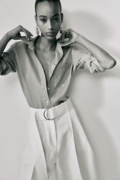 Shirt in airy linen. Collar  buttons at front  and a patch chest pocket. Gently dropped shoulders  long sleeves with button at cuffs  and double-layered yoke at back. Gently rounded hem. Collared Linen Blouse With Button Cuffs, Chic Linen Shirt With Shirttail Hem, Linen Shirt With Shirttail Hem For Day Out, Chic Linen Top With Spread Collar, Effortless Summer Blouse With Pockets, Summer Shirt With Button Cuffs For Daywear, Linen Blouse With Button Cuffs And Spread Collar, Chic Linen Top With Placket, Spring Linen Blouse With Spread Collar