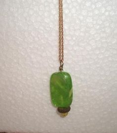 Vintage Iridescent electric green marbled rectangular shaped pendant with rounded corners. It measures approx. 1-1/4 inch. Very shimmery and opalescent. On a gold tone chain. Add it to your jewelry wardrobe. All sales are final. Thank you for looking. You may also love this: https://www.etsy.com/listing/216387835/green-yellow-beaded-bracelet-chunky?ga_search_query=green%2Bjewelry&ref=shop_items_search_37 Vintage Green Rectangular Necklace, Handmade Green Rectangular Necklace, Handmade Green Rectangular Pendant Jewelry, Handmade Green Rectangular Jewelry, Vintage Green Rectangular Jewelry, Iridescent Jewelry, Pendant Necklace Vintage, Electric Green, Jewelry Wardrobe