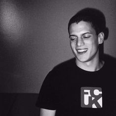 black and white photograph of a young man smiling